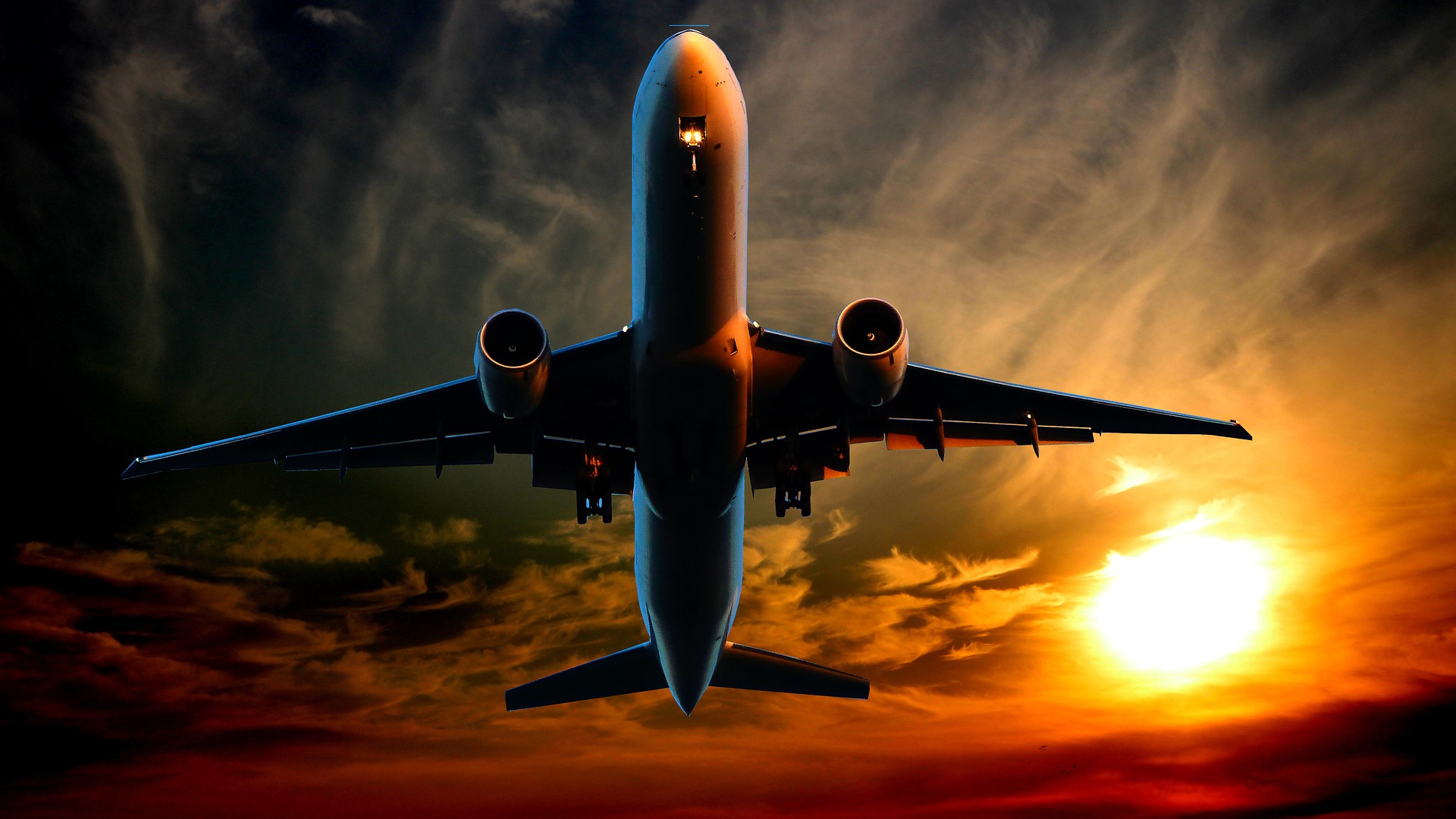 Aircraft climbing at sunset
